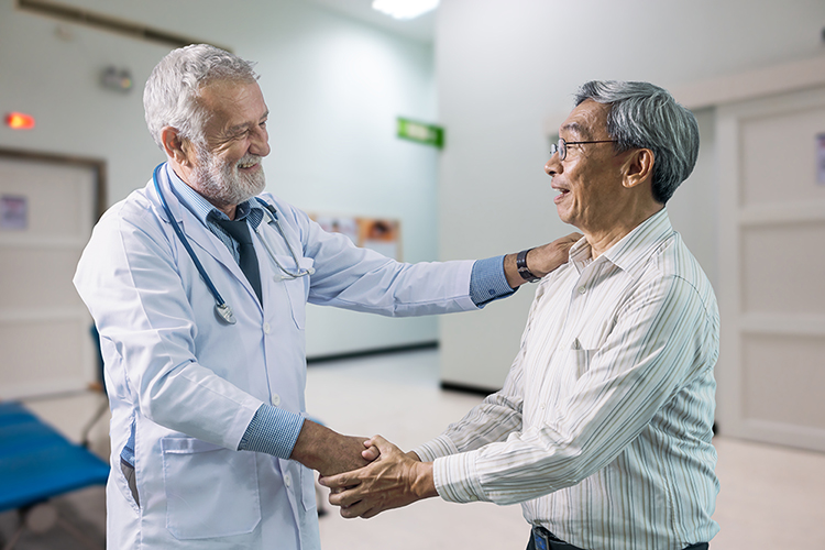 The senior doctor and elderly patient happiness together