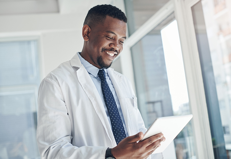 Physician looking at a tablet to get making care primary data