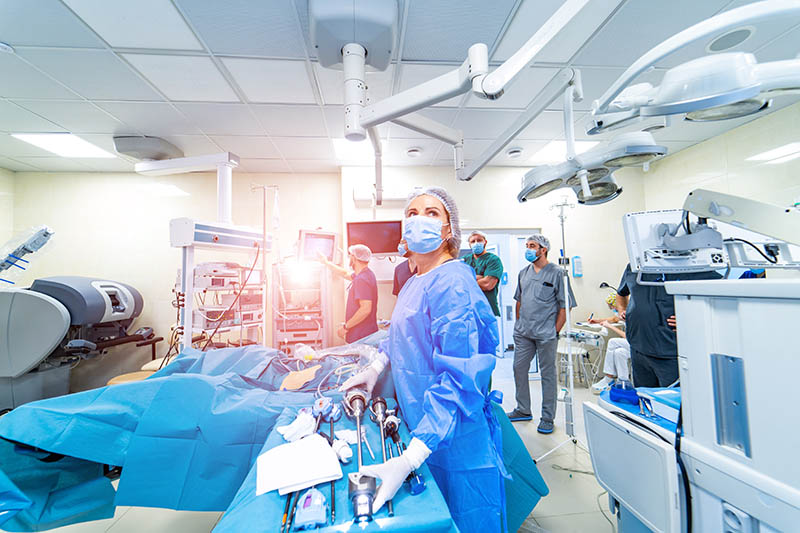 Nurse preparing equipment in surgery room