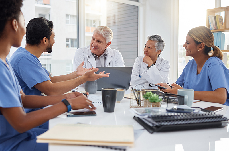 Doctors collaborating on data quality measures and analytics