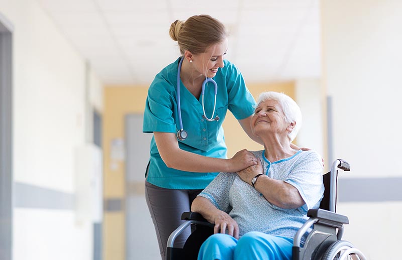 Nurse smiling over providing patient-centered care